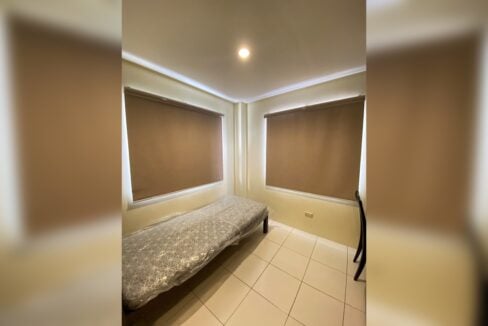 Small bedroom with the roller blinds lowered