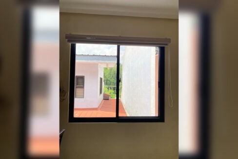 Bedroom window looking out to the neighbouring rooftops