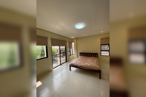 Bedroom with a sliding door to a private balcony