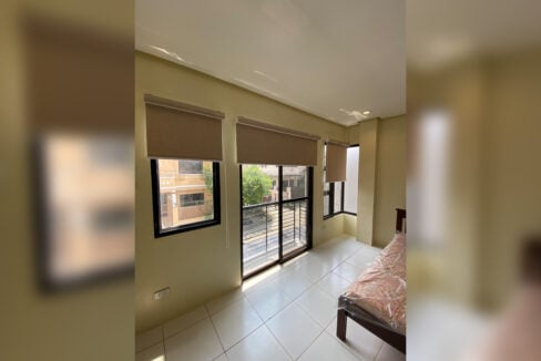 Bedroom windows and balcony door with roller blinds
