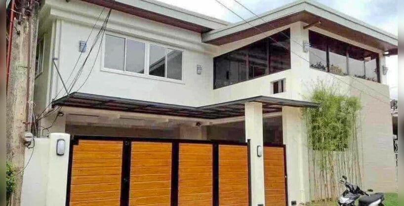 Two-storey fully furnished 5BR house for rent in Banilad with wood-look panel gates and covered garage, Sto. Niño Village