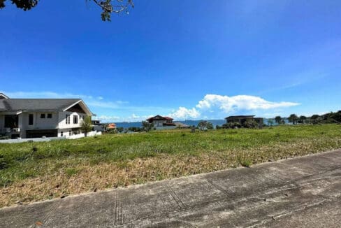 The 411 sqm sea view lot in Liloan seen from its road frontage at Amara Residences, with open water beyond