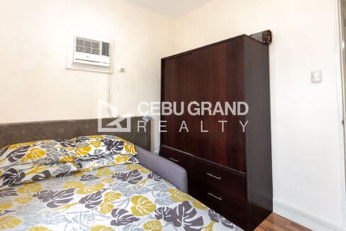 Second bedroom wardrobe with drawers, set beside the air-conditioning unit