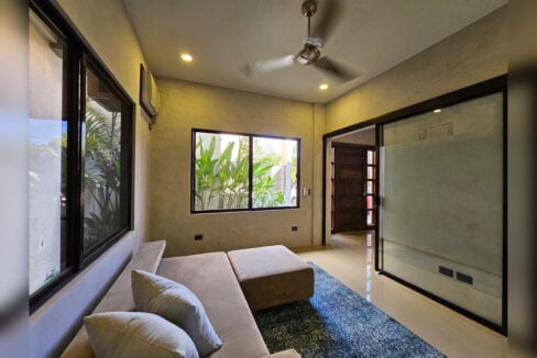 Den with a frosted glass sliding door and split-type air conditioning