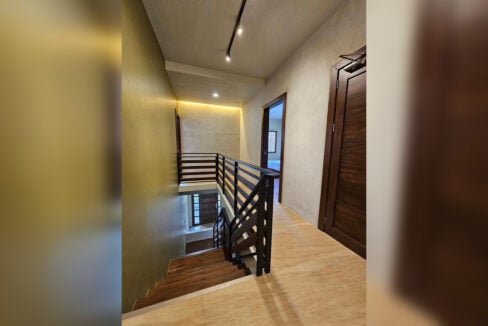 Upstairs landing with track lighting and cove lighting
