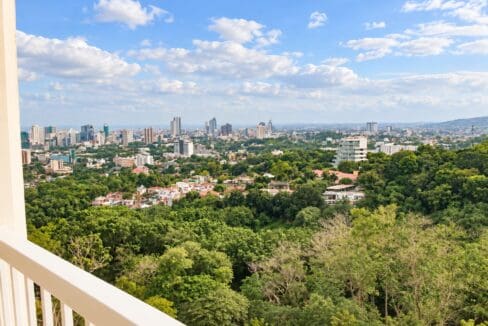 City skyline and treetop view from the balcony of an 8th-floor unit at Marco Polo Residences, Cebu City
