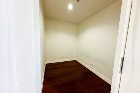 Maid’s room with hardwood flooring