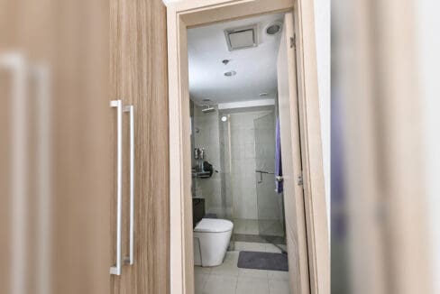 Second bathroom with glass shower enclosure in the 2BR condo at Solinea Tower 3