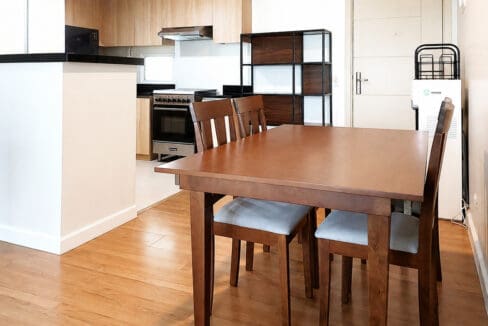 Dining area seating four beside the kitchen in the 2BR corner unit at Solinea Tower 3, Cebu Business Park