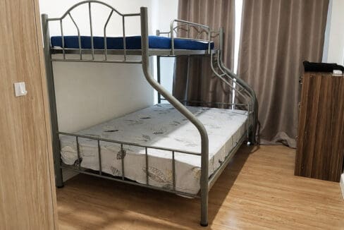 Second bedroom with bunk bed and fitted wardrobe in the 2BR corner unit at Solinea Tower 3