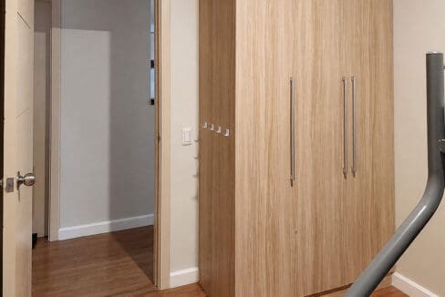 Fitted wardrobe in the second bedroom of the 2BR corner unit at Solinea Tower 3