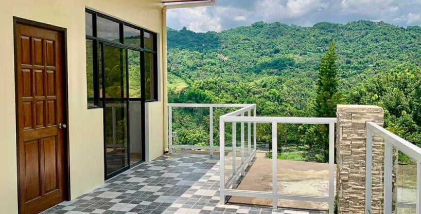 Roof deck of the house and lot for sale in Binaliw, with glass railings and mountain views