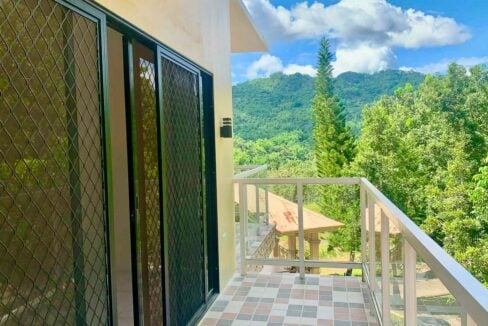 Balcony with sliding glass doors and a view of the mountains