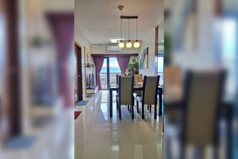 Open living and dining area looking toward the balcony in the 2BR at Soltana Nature Residences