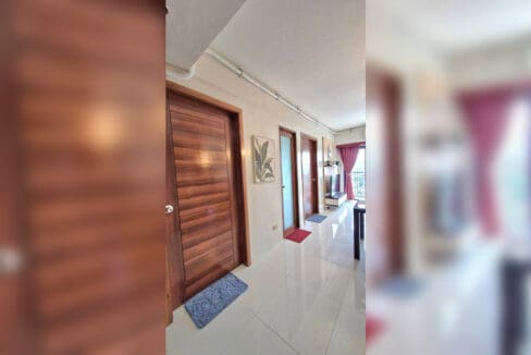 Hallway with timber doors in the 2BR at Soltana Nature Residences, 14th floor of Tower 1