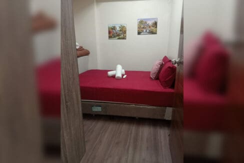 Second bedroom with wood-look flooring in the 2BR at Soltana Nature Residences