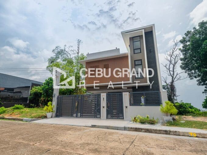 Brand new 4 storey house for sale at Vista Grande, Talisay, seen from the street behind its grey slat gate