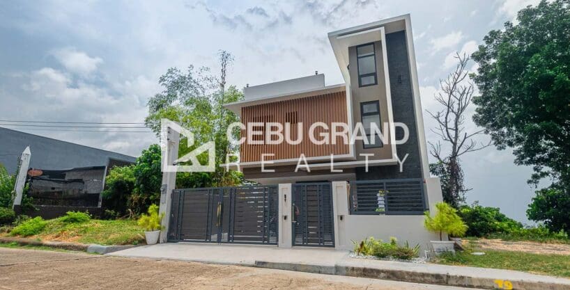 Brand new 4 storey house for sale at Vista Grande, Talisay, seen from the street behind its grey slat gate
