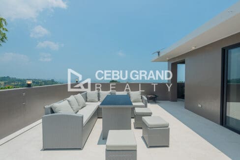 Roof deck seating with the Cebu skyline on the horizon