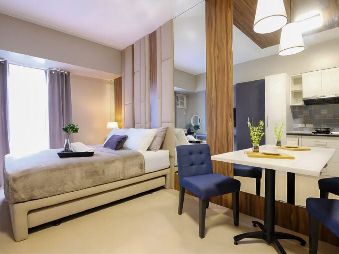 Furnished studio for rent at Avida Riala Tower 1 with bed, mirror wall and dining table