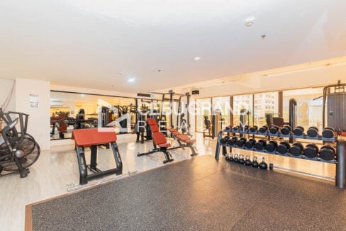 88th Avenue gym with dumbbell racks, benches and weight machines