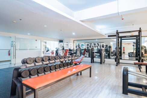 Dumbbell rack, benches and a Smith machine in the gym