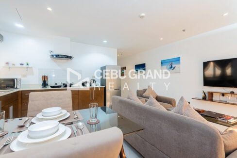 Dining table for four beside the kitchen and living area
