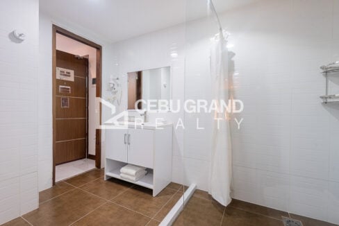 White vanity with mirror and hair dryer in the bathroom