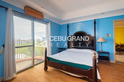 Master bedroom with split aircon and sliding door to the balcony