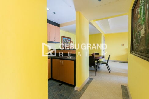 Kitchen counter with sink beside the dining area