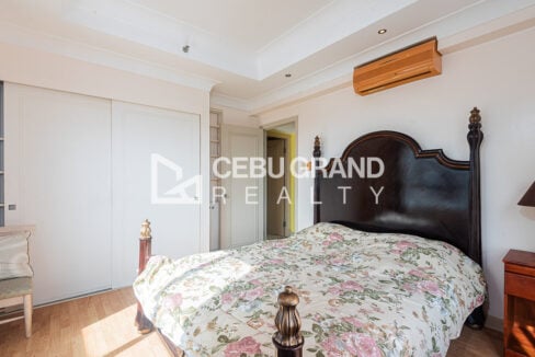 Second bedroom with sliding-door wardrobe and split aircon