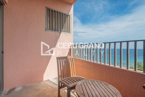Balcony seating facing the turquoise sea at Movenpick Residences