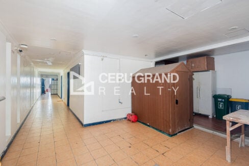 Ground-floor hallway with tiled floors and storage cabinets