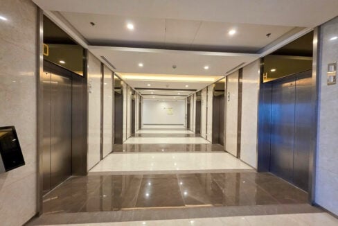 Elevator corridor serving the high-zone office floors at Cebu Exchange