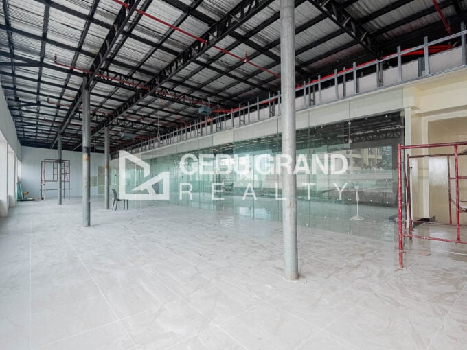 Roof deck office for rent in Kasambagan with a glass partition wall, steel columns and glossy tiled floors