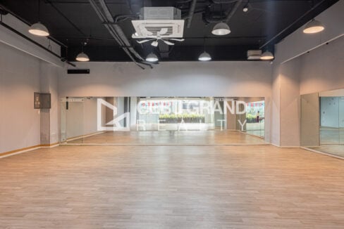 Mirrored dance studio wall under ceiling-cassette air conditioning