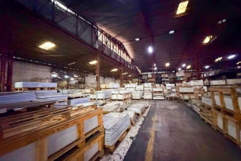 High-bay warehouse hall with clerestory openings and long aisles