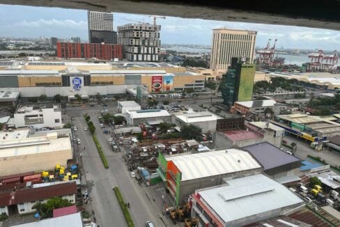 View from the San Marino Residences studio over SM City Cebu and the port