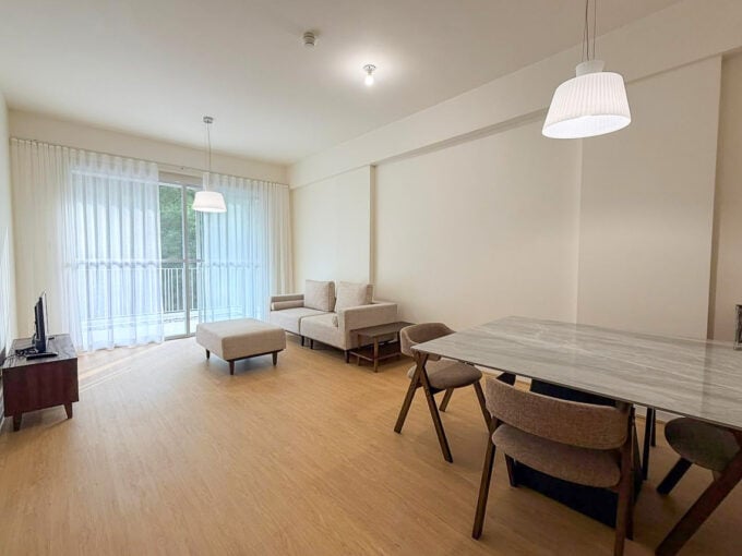 Open living and dining area of a furnished 1BR garden unit at 32 Sanson, Lahug