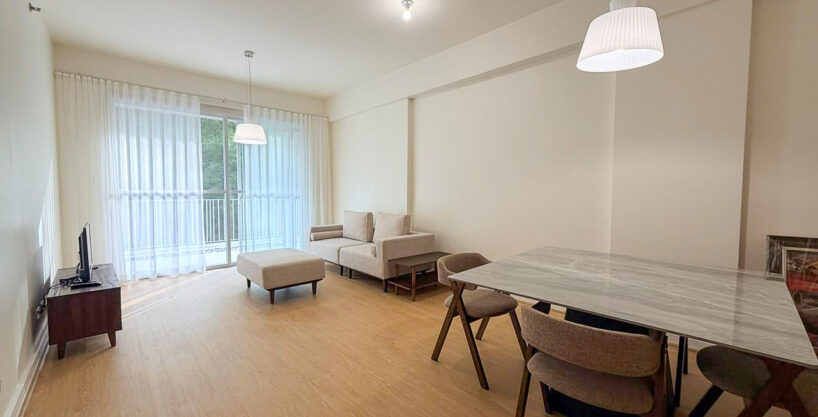 Open living and dining area of a furnished 1BR garden unit at 32 Sanson, Lahug