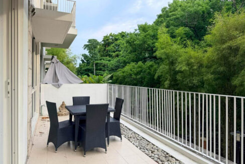 Forest-facing garden terrace with white railing and pebble border at 32 Sanson, Lahug