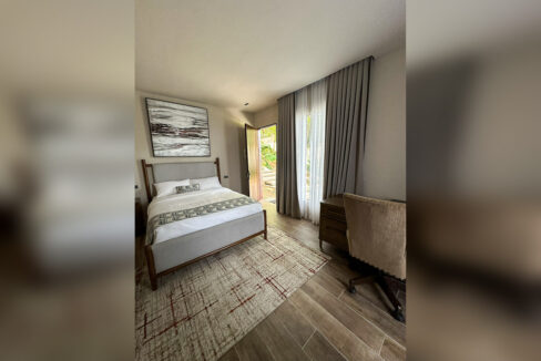 Guest bedroom with a door opening to the garden