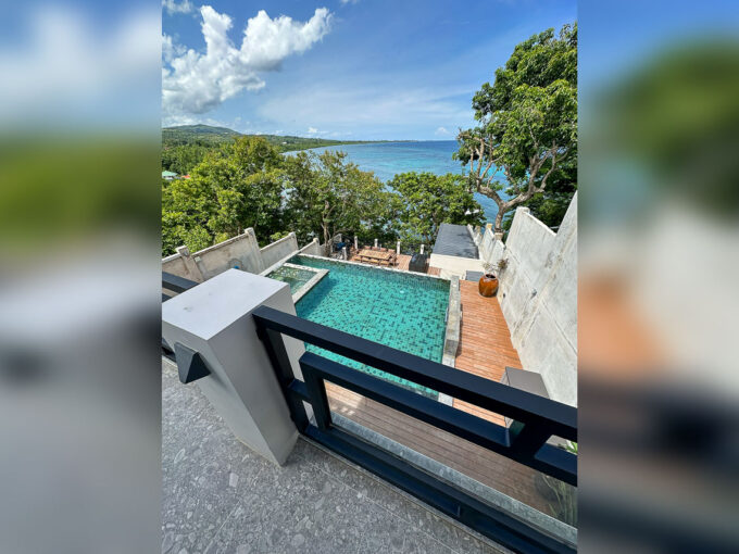 Aerial view of the infinity pool, deck and coastline of Talaga, Argao