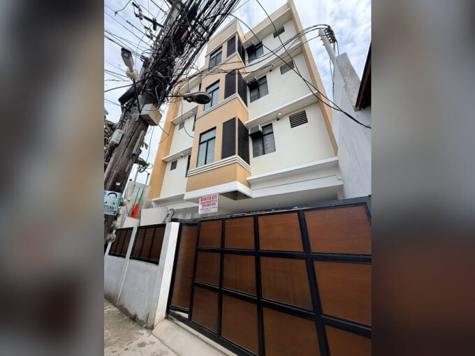 Front of the brand-new four-storey residential building for sale in Subangdaku, Mandaue, with its slatted gate