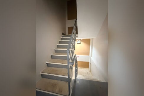 Concrete stairs leading up to the upper floors of the building