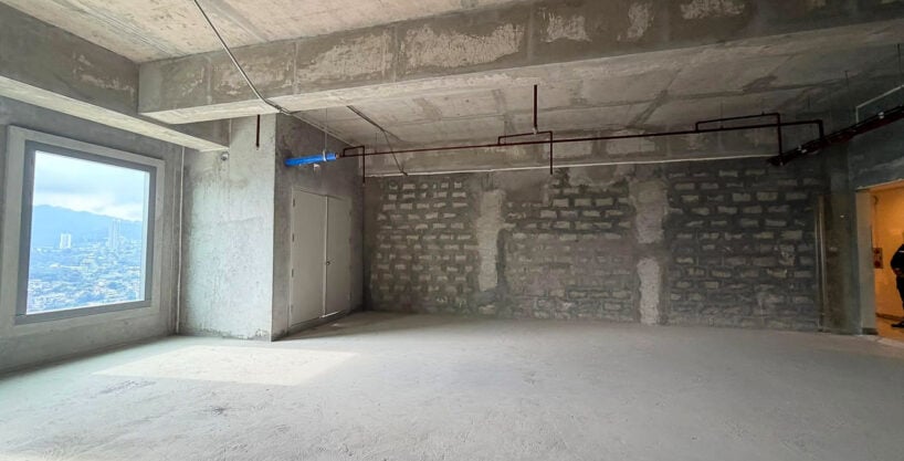 Bare-shell office on the 34th floor of Cebu Exchange with a framed window facing the mountains
