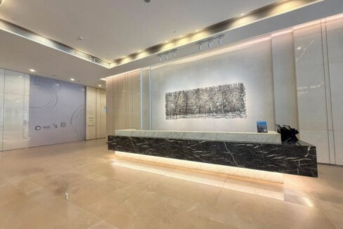 Cebu Exchange ground-floor lobby with a black marble reception desk and wall art