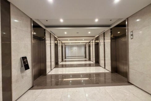 Marble-clad elevator corridor on the 34th floor