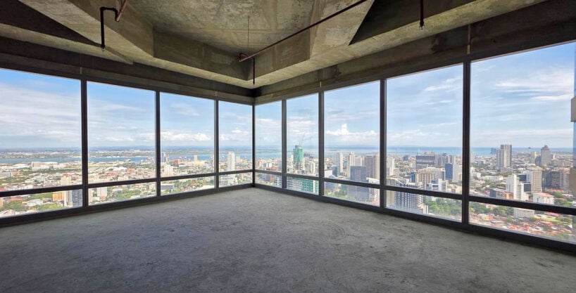 Corner office on the 38th floor of Cebu Exchange with floor-to-ceiling glass over the city and sea