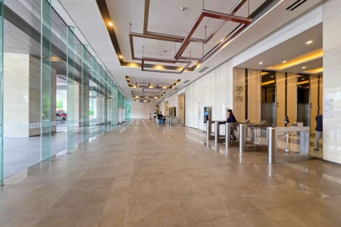 Cebu Exchange ground-floor lobby with full-height glass and security turnstiles